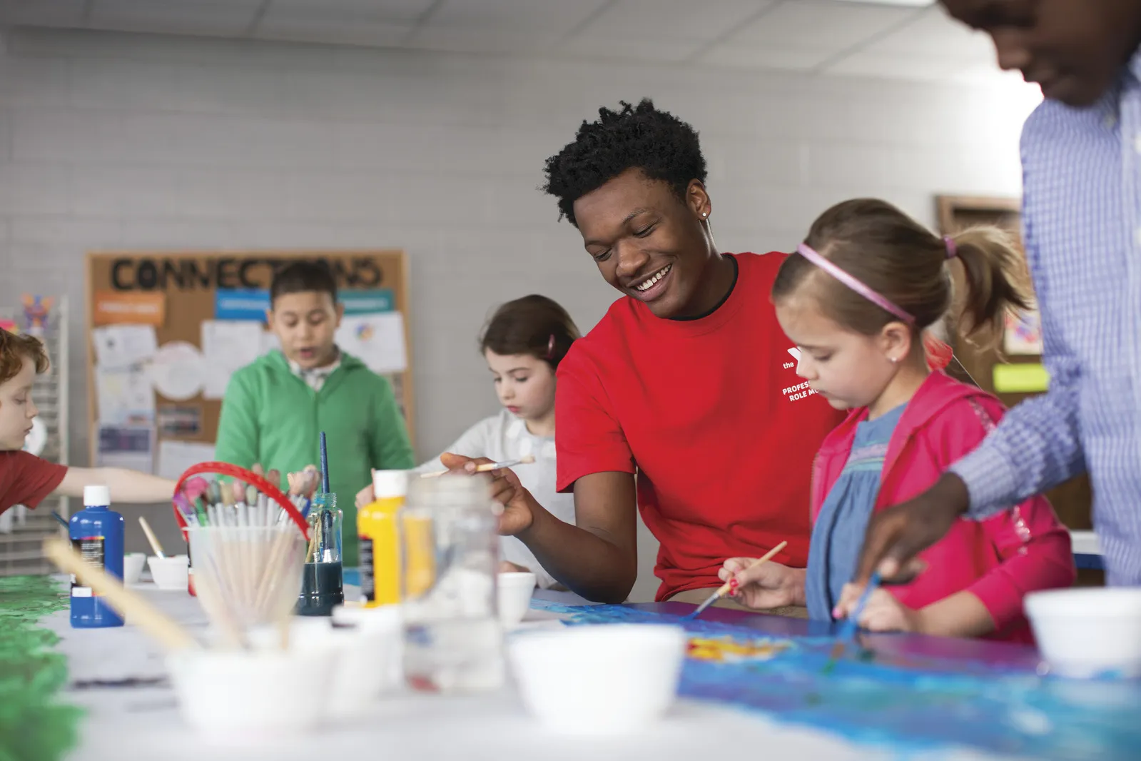 Afterschool Counselor in Red Shirt