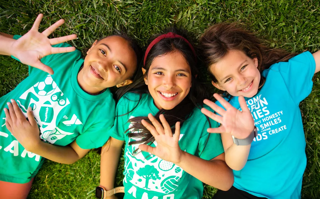 Three young summer camp girls