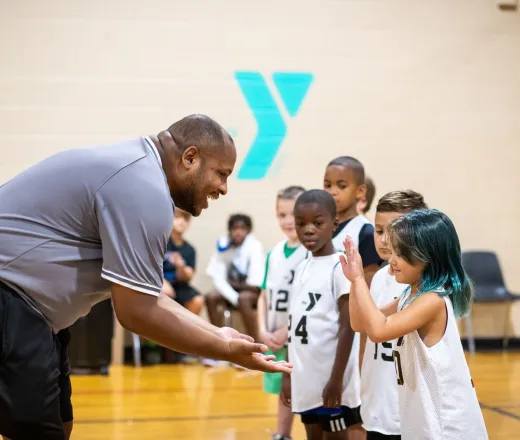 basketball coach congratulating team